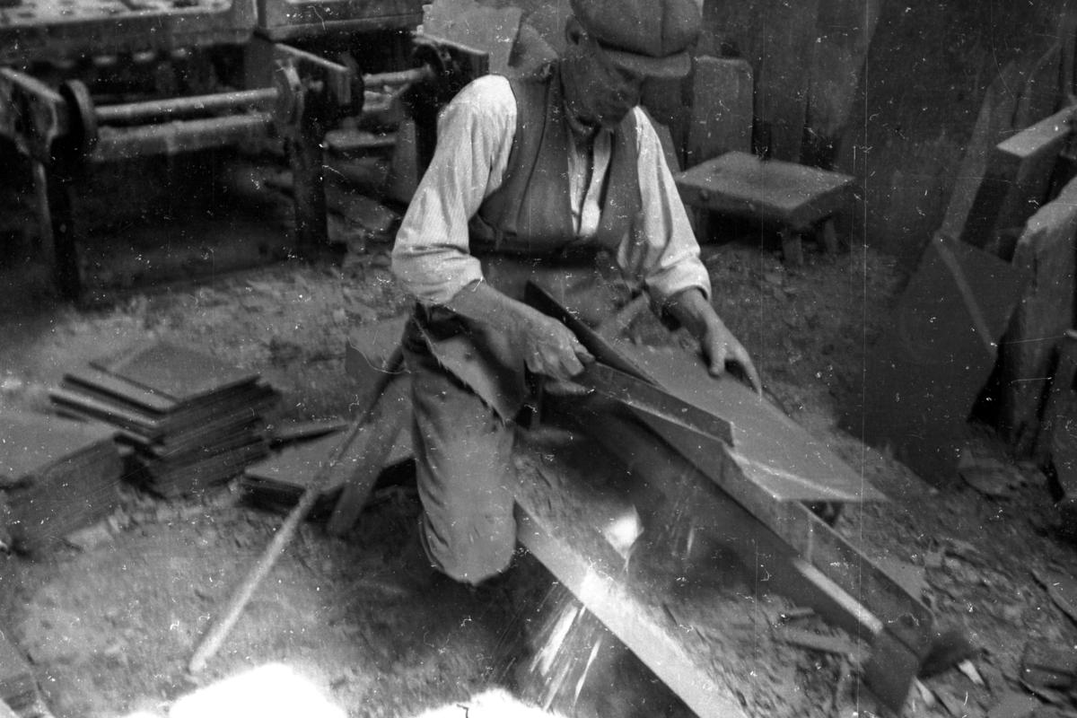 Quarryman dressing a slate by hand at Penrhyn Slate Quarry