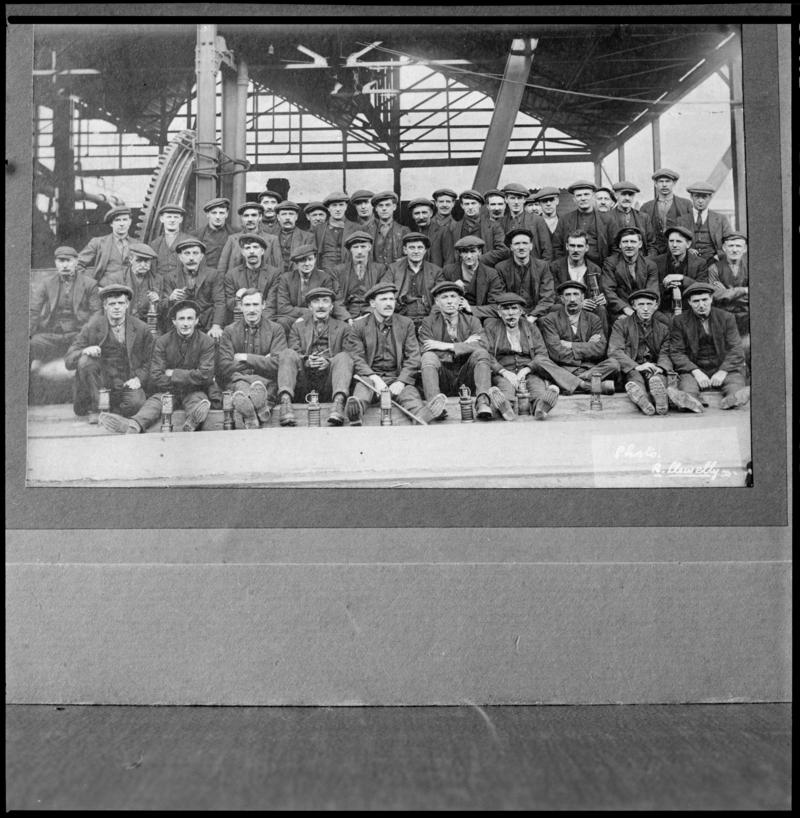 Black and white film negative of a photograph showing a large group of miners, Bargoed Colliery.  'Bargoed' is transcribed from original negative bag.