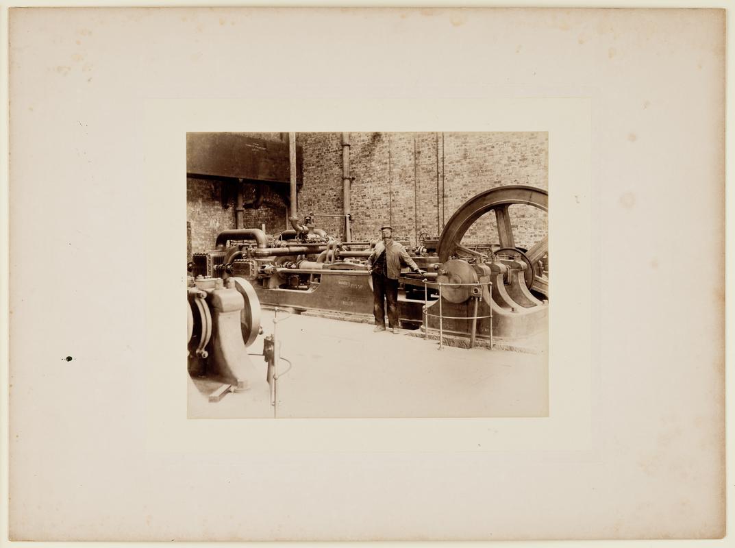 The interior of the pump house showing the installation of the Tannett Walker & Co. steam pumping engine during the construction of Barry No. 1 Dock. Mounted on card.