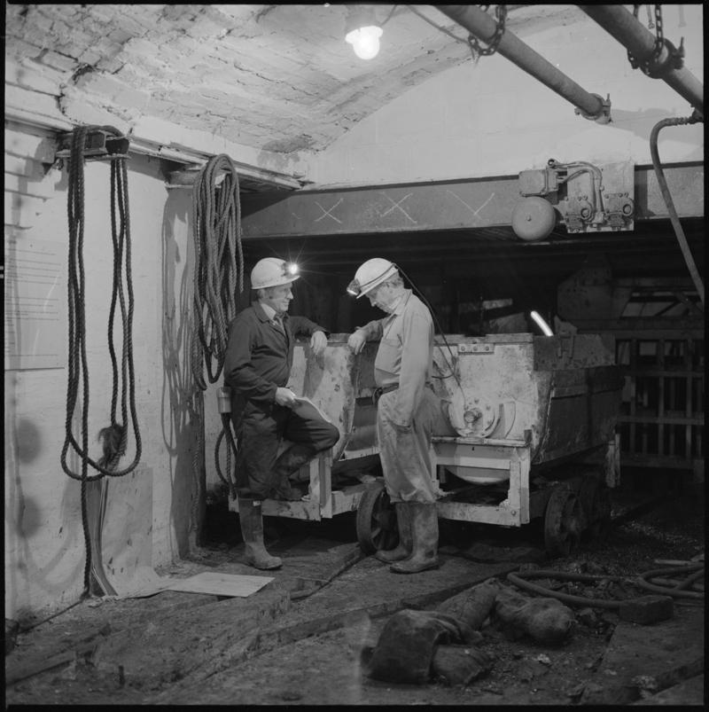 Black and white film negative showing two miners at pit bottom, Big Pit Colliery.  'Big Pit Blaenavon' is transcribed from original negative bag.