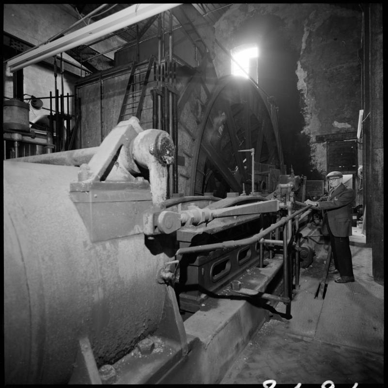 Black and white film negative showing George Watkins in the engine house, Elliot Colliery.  'East Elliot' is transcribed from original negative bag.