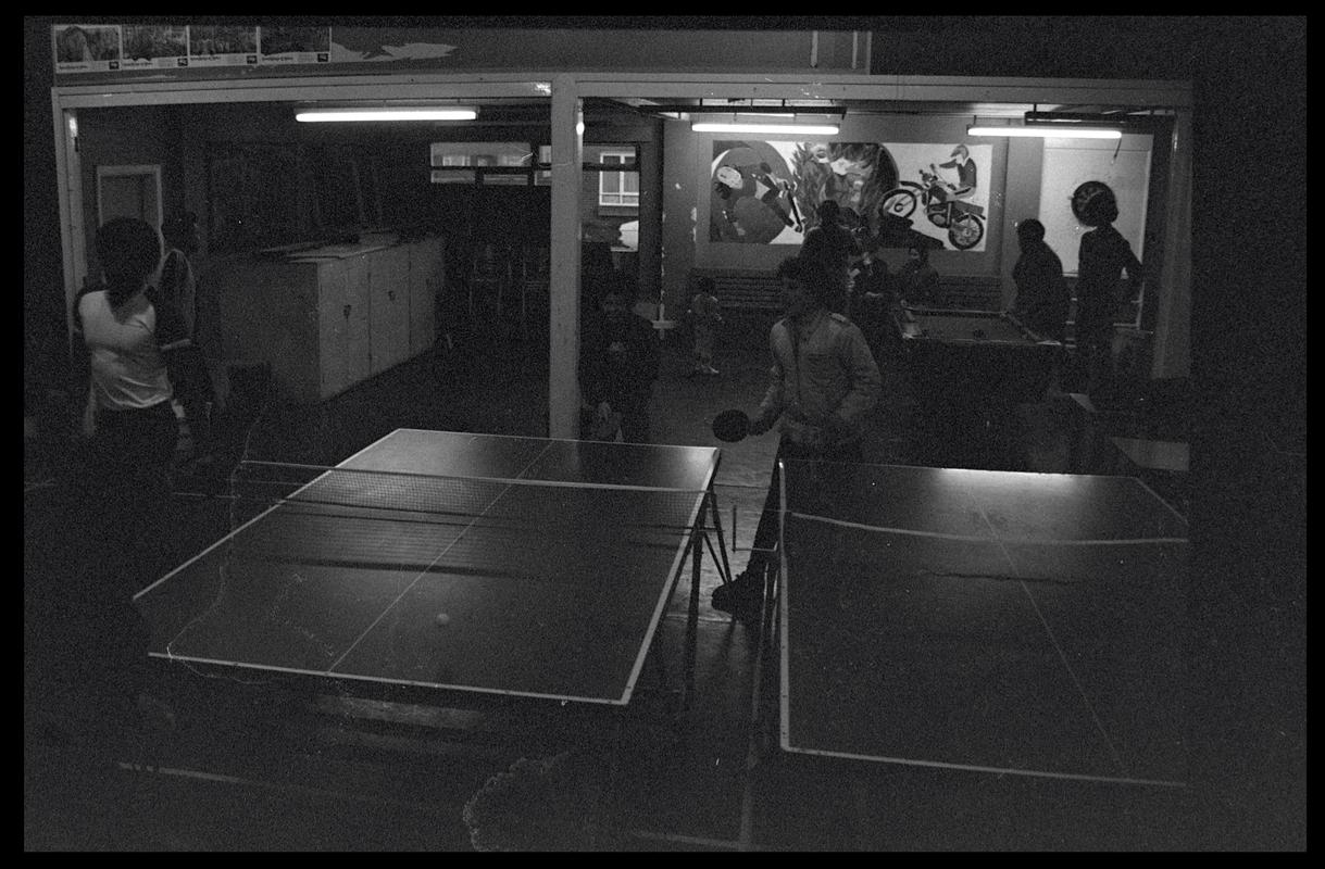 Teenagers playing table tennis at Butetown Youth Club.