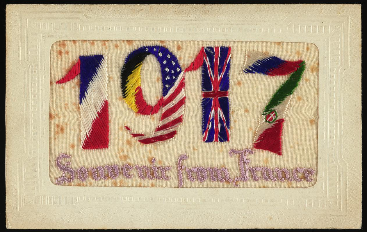 Embroidered postcard inscribed '1917 Souvenir from France'. Handwritten message on back. Dated 17 October 1917. Sent to Miss Evelyn Hussey, sister of Corporal Hector Hussey of the Royal Welch Fusiliers, during the First World War.