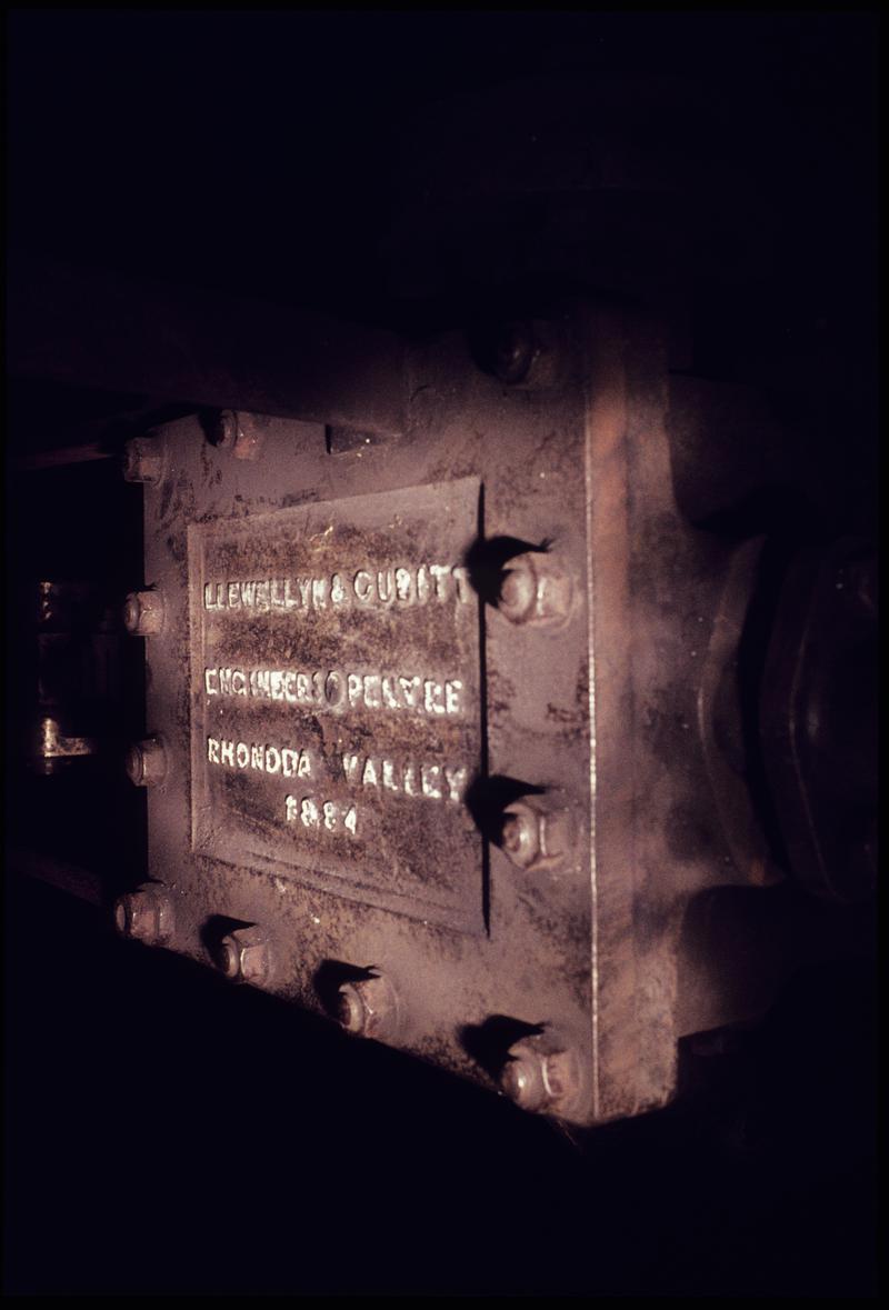 Colour film slide showing the cylinder cover of the Llewellyn & Cubit haulage engine, Western Colliery, July 1976