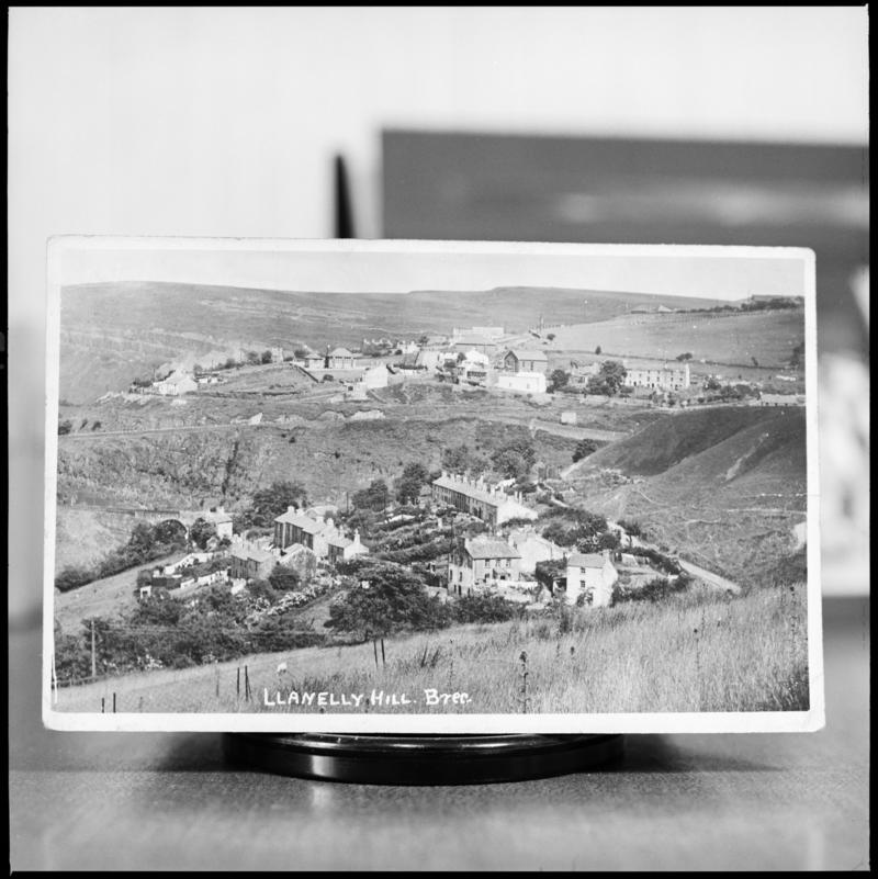 Black and white film negative showing a general view of Llanelly Hill, Abergavenny.  'The Whistle' is transcribed from original negative bag.