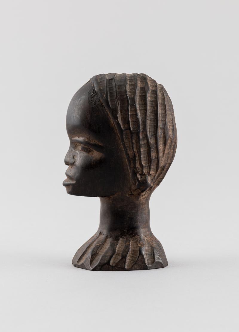 Carved ebony female head (Amina) from Northern Nigeria.