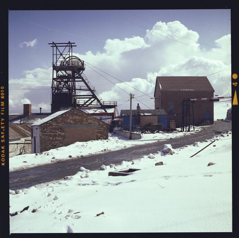 Colour film negative showing the headgear and engine house, Big Pit.