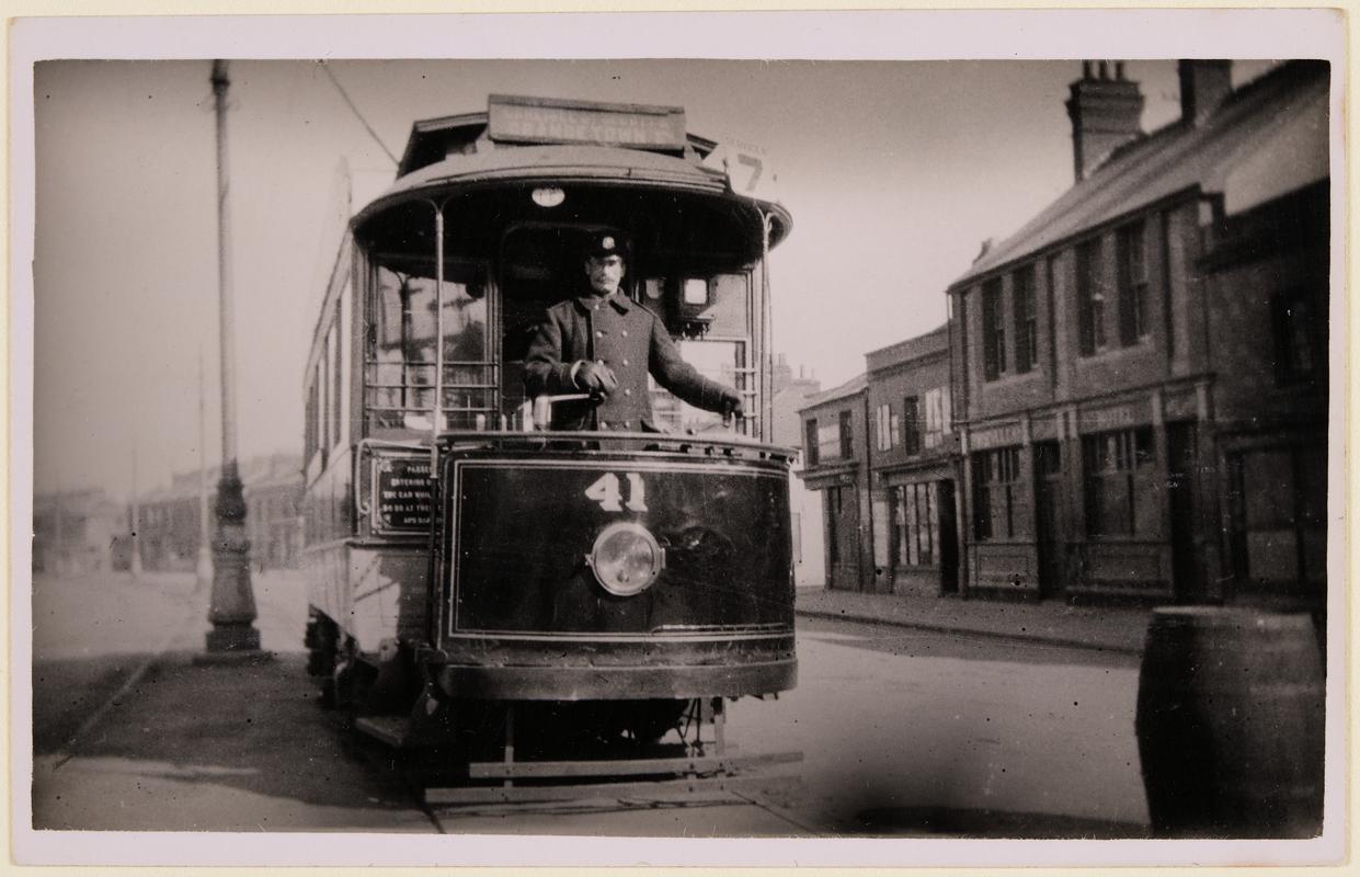 ‘Single deck car No. 41 on Service 7 (Carlisle St, Splott and Grangetown) in Adam Street 1919. Driver Middleton is at the controls and the photograph was taken by E. Bowden, Inspector C.C.T. The Vulcan Hotel is seen on the right'.