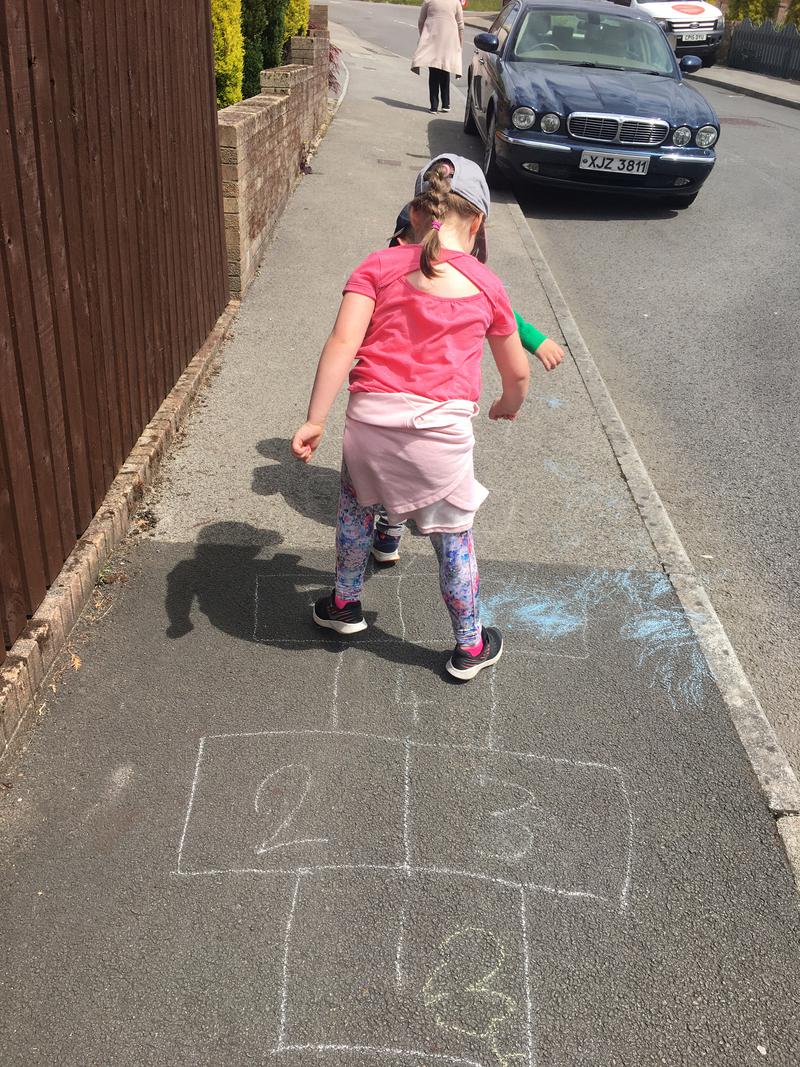 On our daily walk and coming across a hop scotch on the pavement!