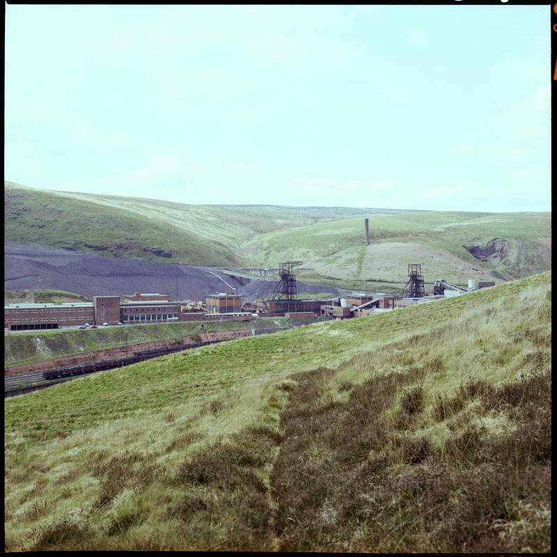 Colour film negative showing a landscape view, looking towards Maerdy Colliery.  'Mardy' is transcribed from original negative bag.