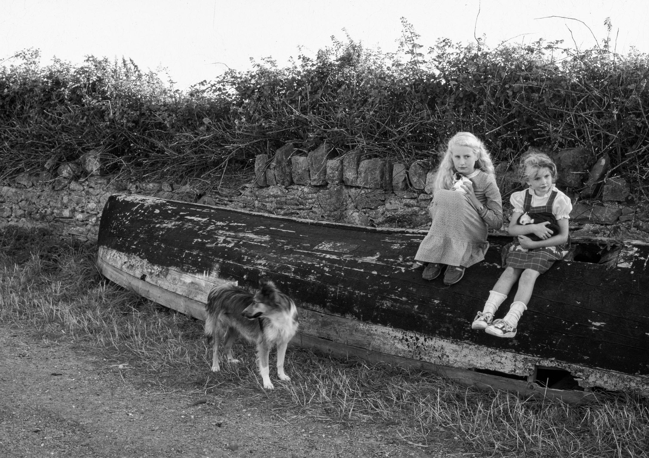 Sherkin Island. Local children guard their pets. County Kerry. Ireland