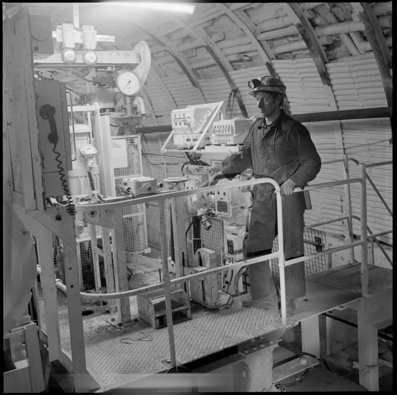Colour film negative showing a man operating the haulage engine underground at Cwmtillery Colliery.  'Cwmtillery' is transcribed from original negative bag.