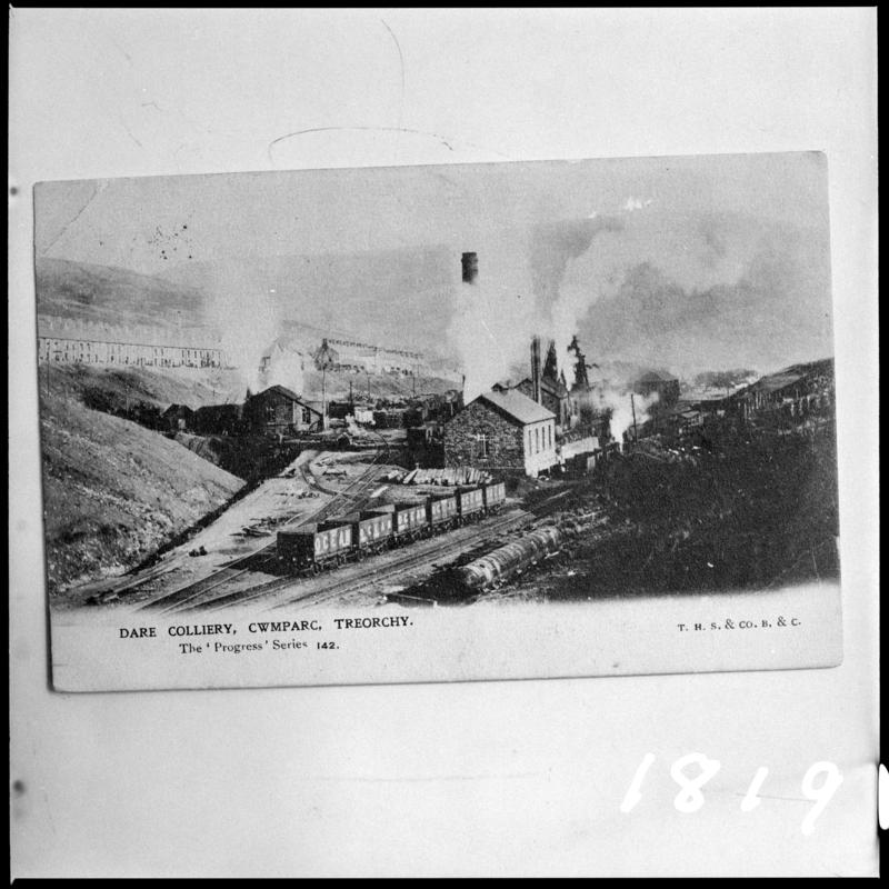 Black and white film negative of a photograph showing a surface view of Dare Colliery, Cwmparc, Treorchy.  'Dare Colliery' is transcribed from original negative bag.