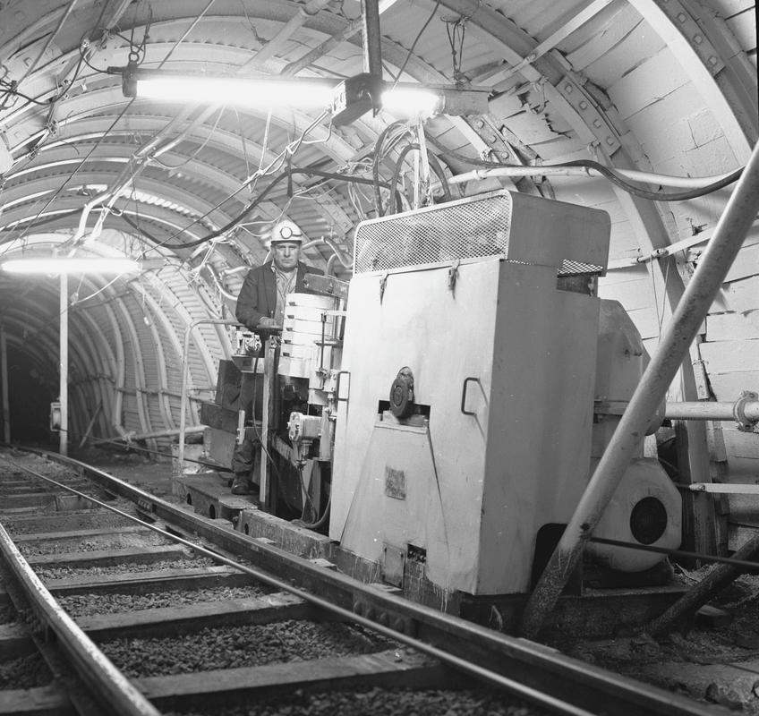 Black and white film negative showing a haulage engine and operator, Oakdale Colliery, May 1980.  'Oakdale May 1980' is transcribed from original negative bag.