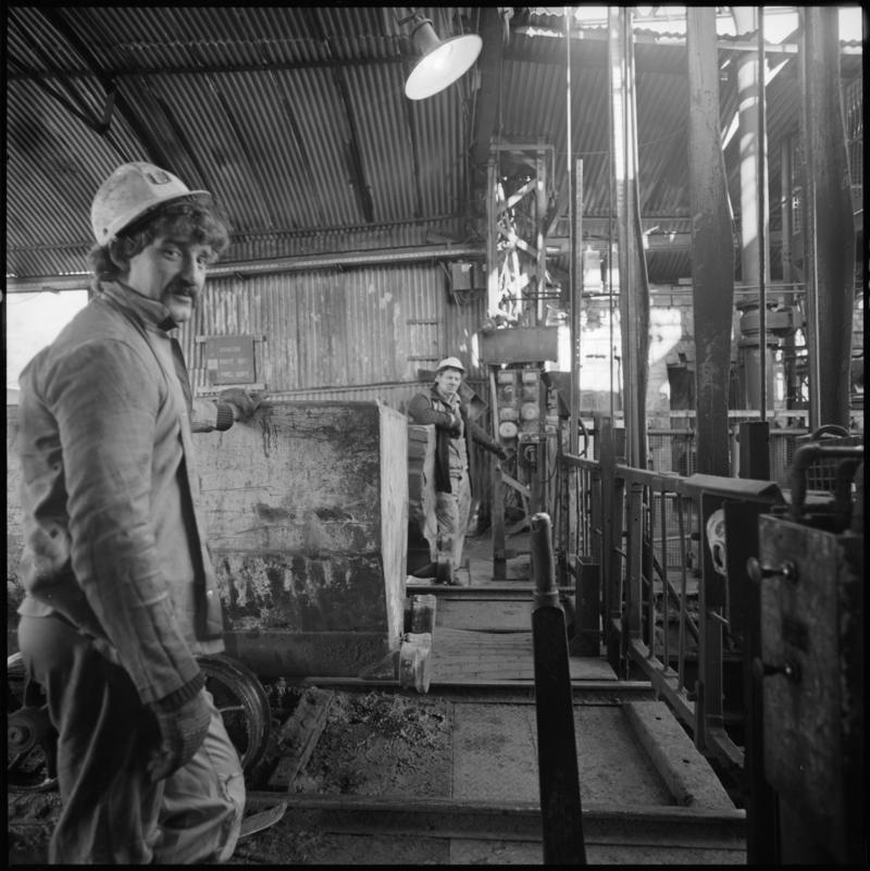 Black and white film negative showing a ?Banksman at pit top, St John's Colliery.