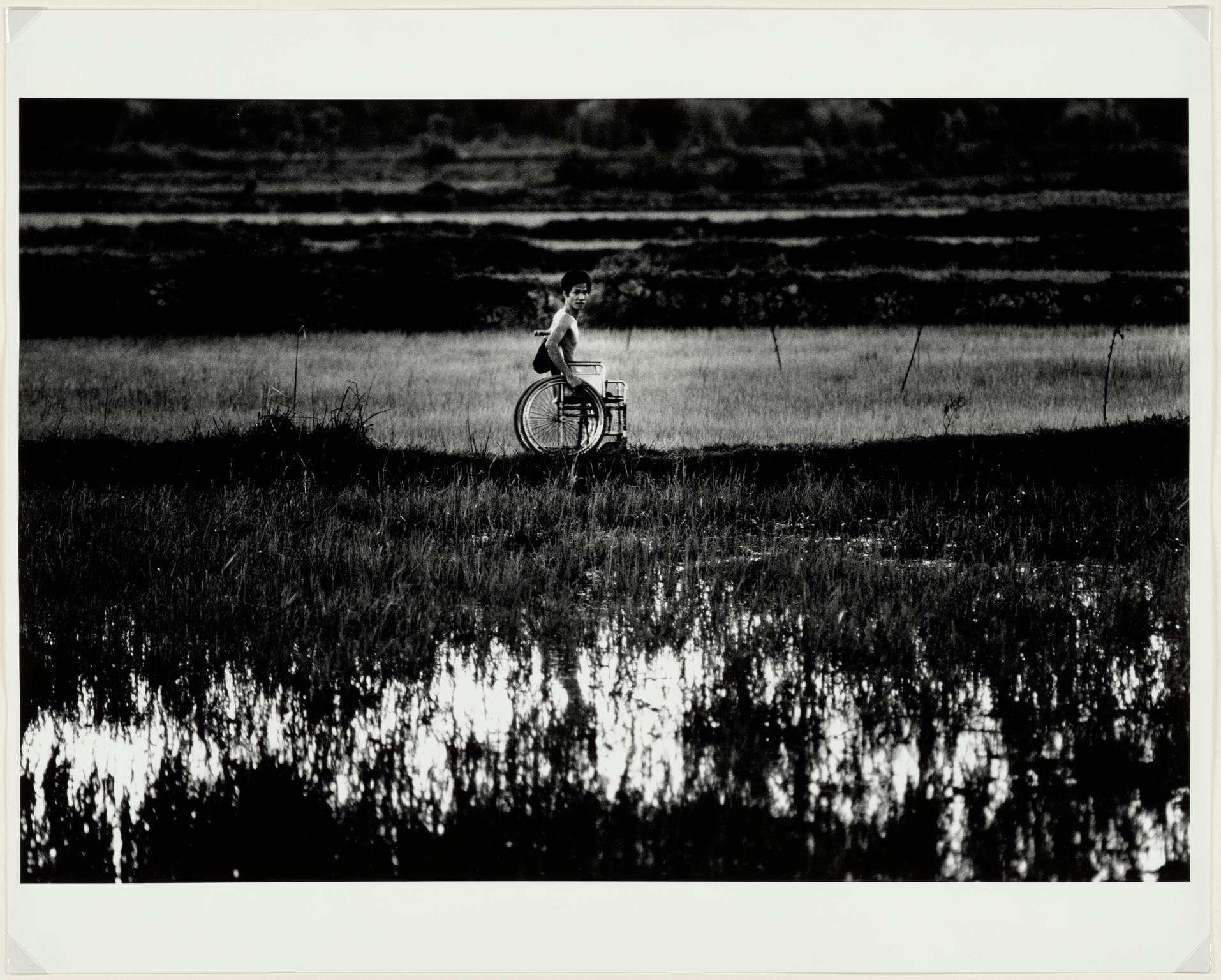 Amputee in rice field, 1967