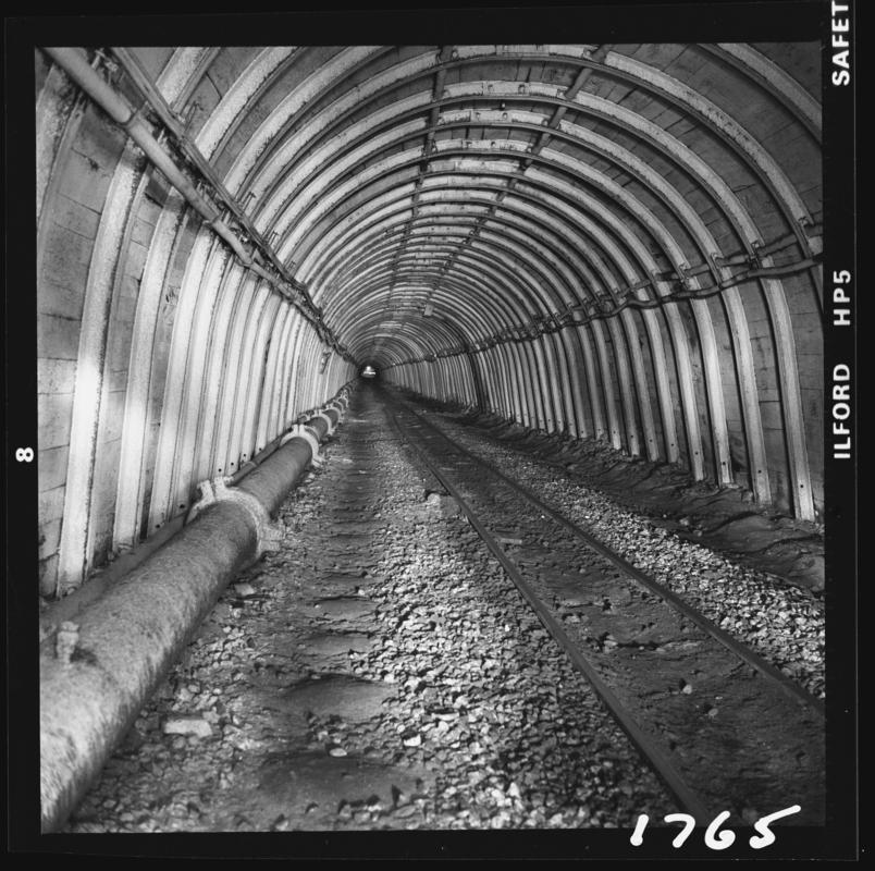 Black and white film negative showing an almost perfect section of main road in Blaengwrach Mine, 1 November 1979.