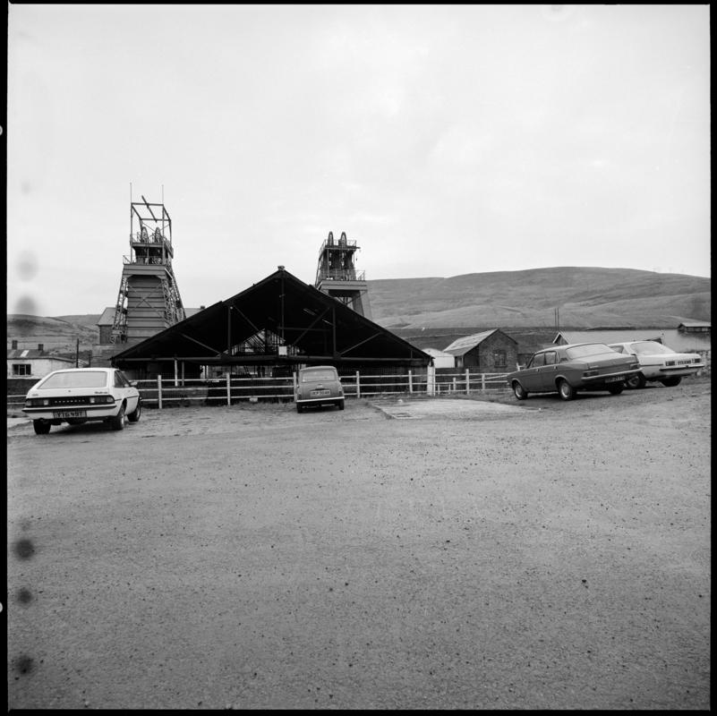 Black and white film negative showing a view of Coegnant Colliery taken from the car park,  25 November 1981.  '25 Nov 1981' is transcribed from original negative bag.