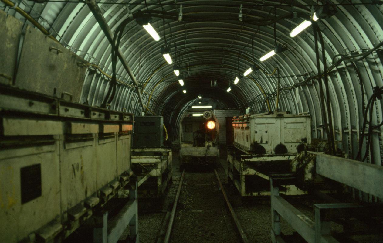 Colour film slide showing a battery operated locomotive and charging bays, Oakdale Colliery 21 May 1981.