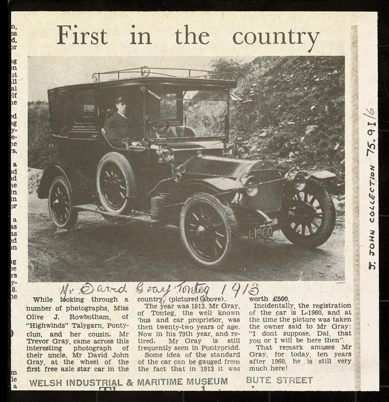 Newspaper cutting headed "First in the Country", showing a photo of Mr D.J. Gray at the wheel of the first free axle "Star" car in the Country in 1913