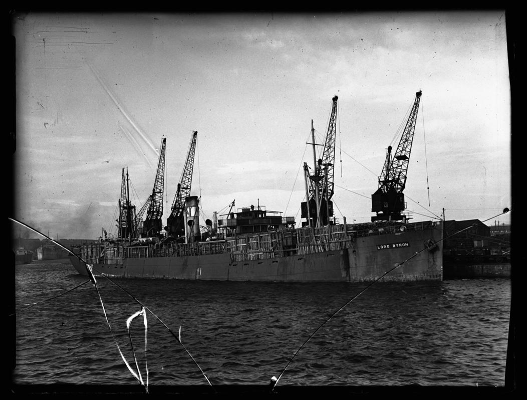 Starboard bow view of S.S. LORD BYRON with timber deck cargo at Cardiff docks, c.1947.