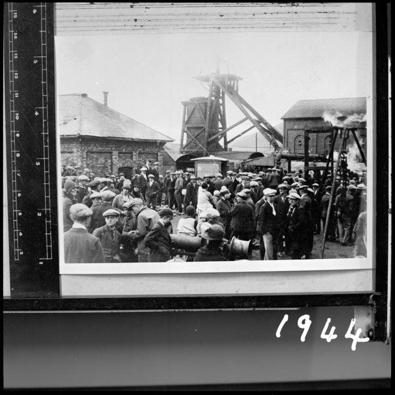 Black and white film negative of a photograph showing a group of miners on the surface, Milfraen Colliery, Blaenavon.  'Milfraen' is transcribed from original negative bag.