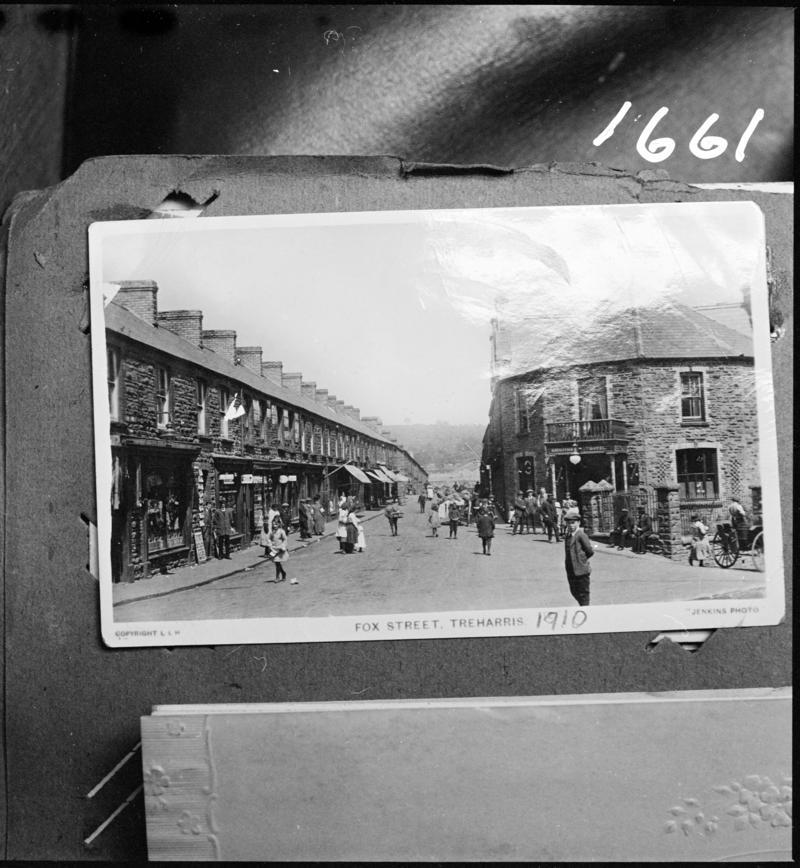 Black and white film negative of a photograph showing Fox Street, Treharris, 1910.