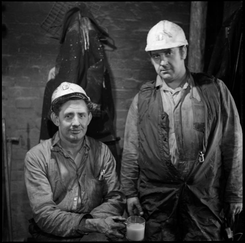 Black and white film negative of a photograph showing two Celynen South Colliery workers, 6 November 1985.  'South Celynen 6 Nov 1985' is transcribed from original negative bag.