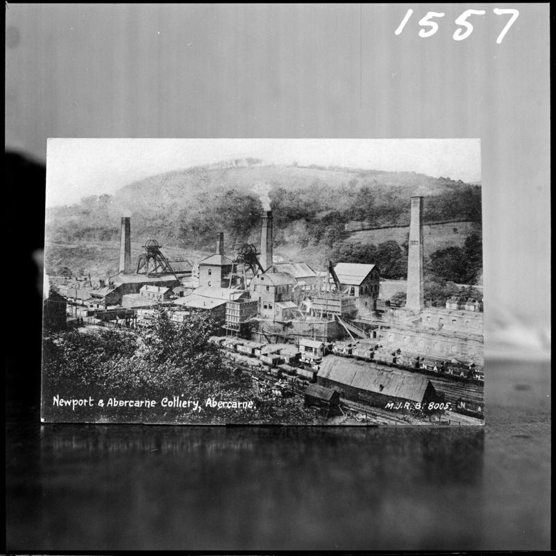 Black and white film negative of a postcard? showing a general surface view of Celynen South Colliery.  Bottom of postcard reads 'Newport & Abercarne Colliery, Abercarne'.    'South Celynen' is transcribed from original negative bag.
