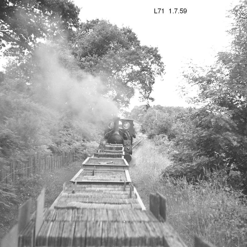 Steam engine and a run of loaded wagons, Penrhyn Quarry Railway