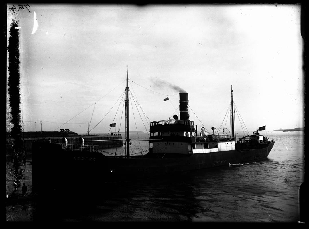 3/4 Port bow view of S.S. ASGERD and waterman's boat entering Cardiff Docks, c.1936