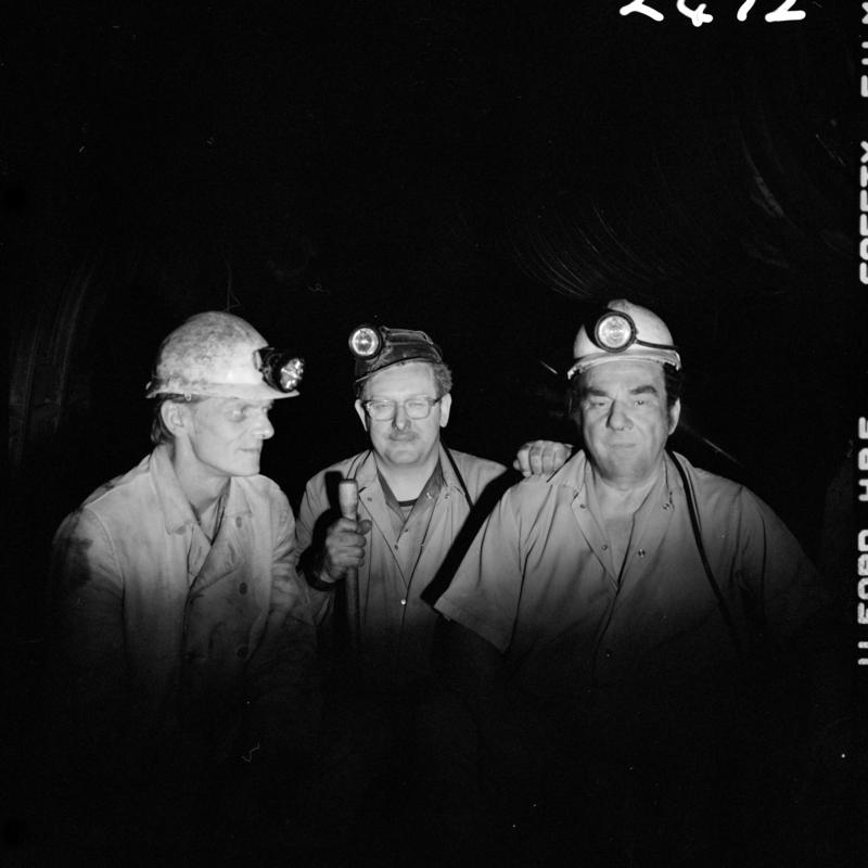 Black and white film negative showing three miners, Merthyr Vale Colliery, 2 July 1981.  'Merthyr Vale 2 Jul 1981' is transcribed from original negative bag.