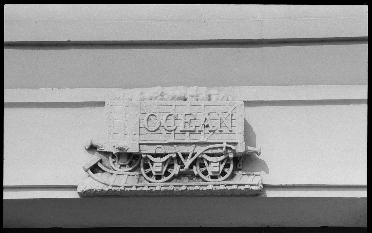 Coal wagon frieze, bearing the name "Ocean" (depicted in stone), on Ocean Buildings, Butetown.