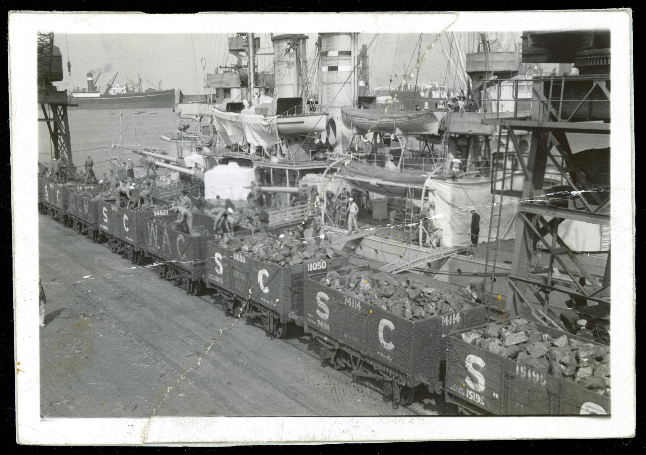 Swedish cruiser FYLGIA bunkering coal, photograph
