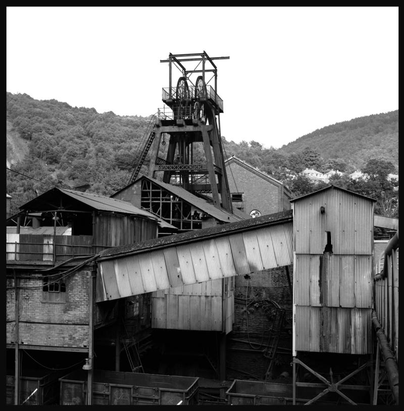 Black and white film negative showing a surface view of Celynen South Colliery, 1978.  The headframe was built by E.Finch & Co of Chepstow.