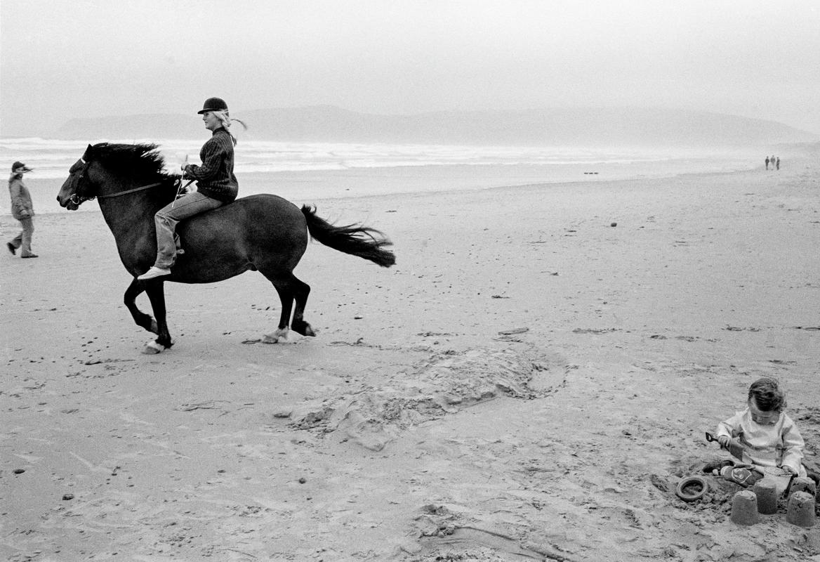 GB. WALES. Abersoch Beach. Wind, horse and sandcastles. 1973.