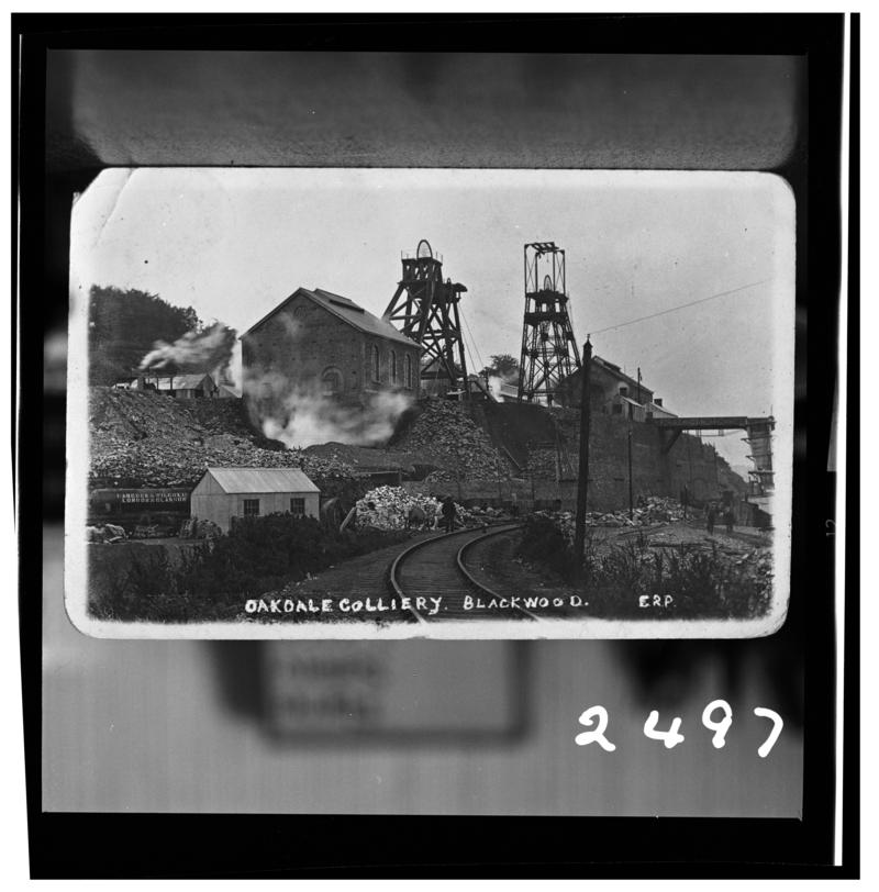 Black and white film negative of a photograph showing a surface view of Oakdale Colliery.  'Oakdale' is transcribed from original negative bag.
