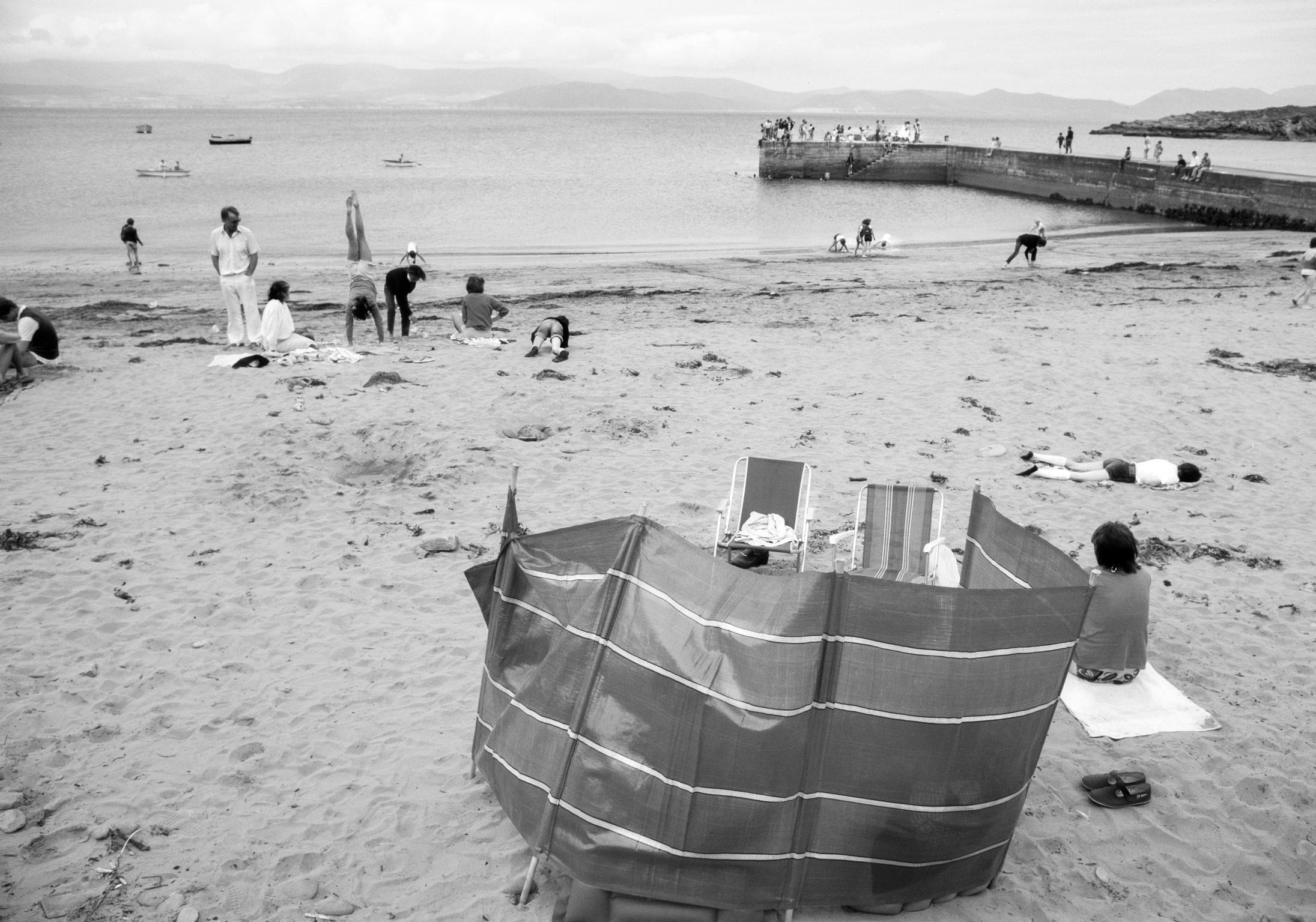 An area where you will seldom see a tourist. Local families enjoy the beach in each their particular way. Kells Bay. Ireland