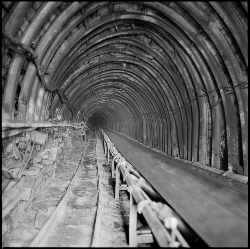 Colour film negative showing a high speed conveyor underground at Cwm Colliery.  'Cwm' is transcribed from original negative bag.