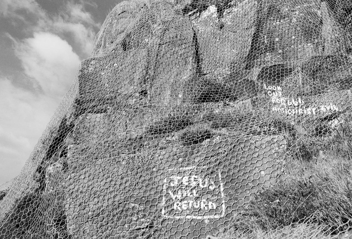 GB. WALES. Treherbert. Primitive sculptures made by a local council worker who's job was to look after the cliff face on the road above the town. 1993.