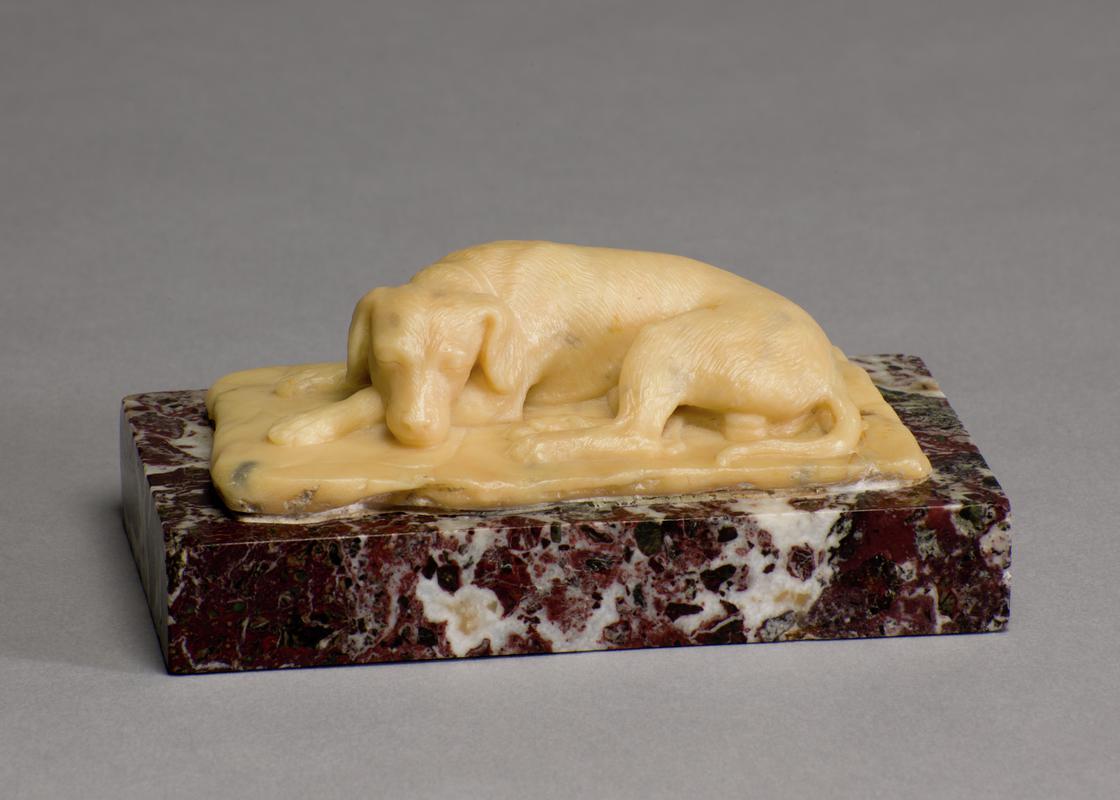 Small sculpture of a sleeping hound