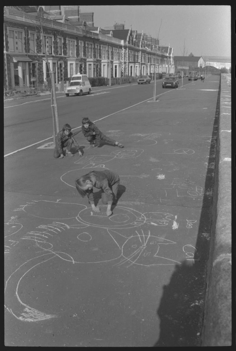 Children playing on pavement at Windsor Esplanade, Butetown.