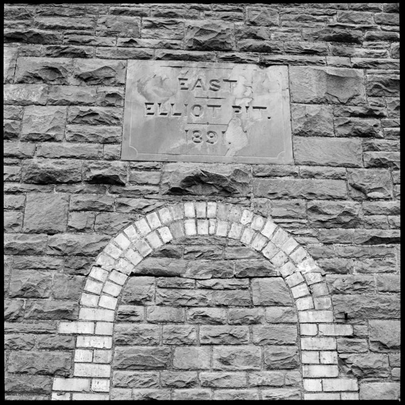 Black and white film negative showing an engraved stone on the exterior of the engine house reading 'East Elliot Pit 1891'. 'East Elliot' is transcribed from original negative bag.