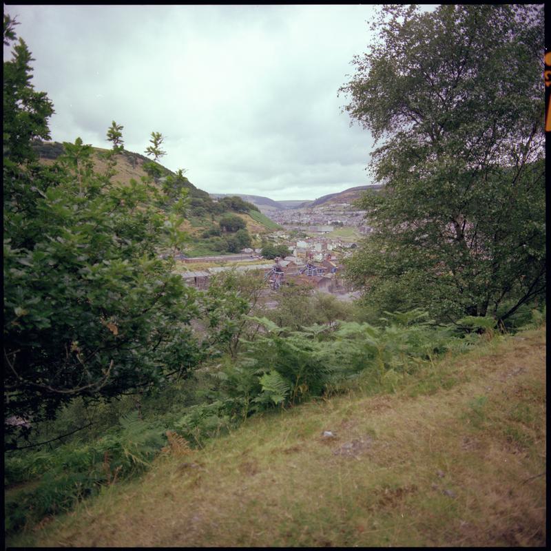 Colour film negative showing a view towards Six Bells Colliery.  'Six Bells' is transcribed from original negative bag.  Appears to be identical to 2009.3/1900.