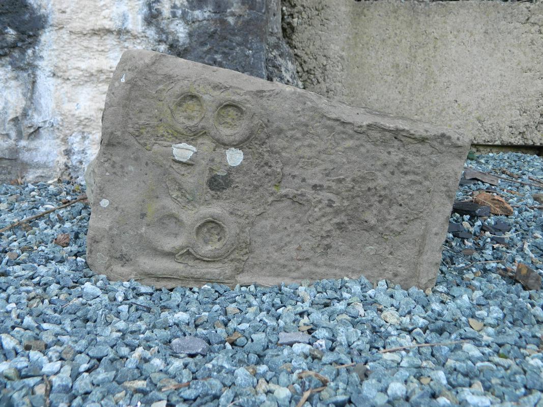 Kilgetty Ironworks, Stepaside: sate stone from one of the blast furnaces inscribed ë1848í now lying loose in front of one of the arches in the charging bank retaining wall.