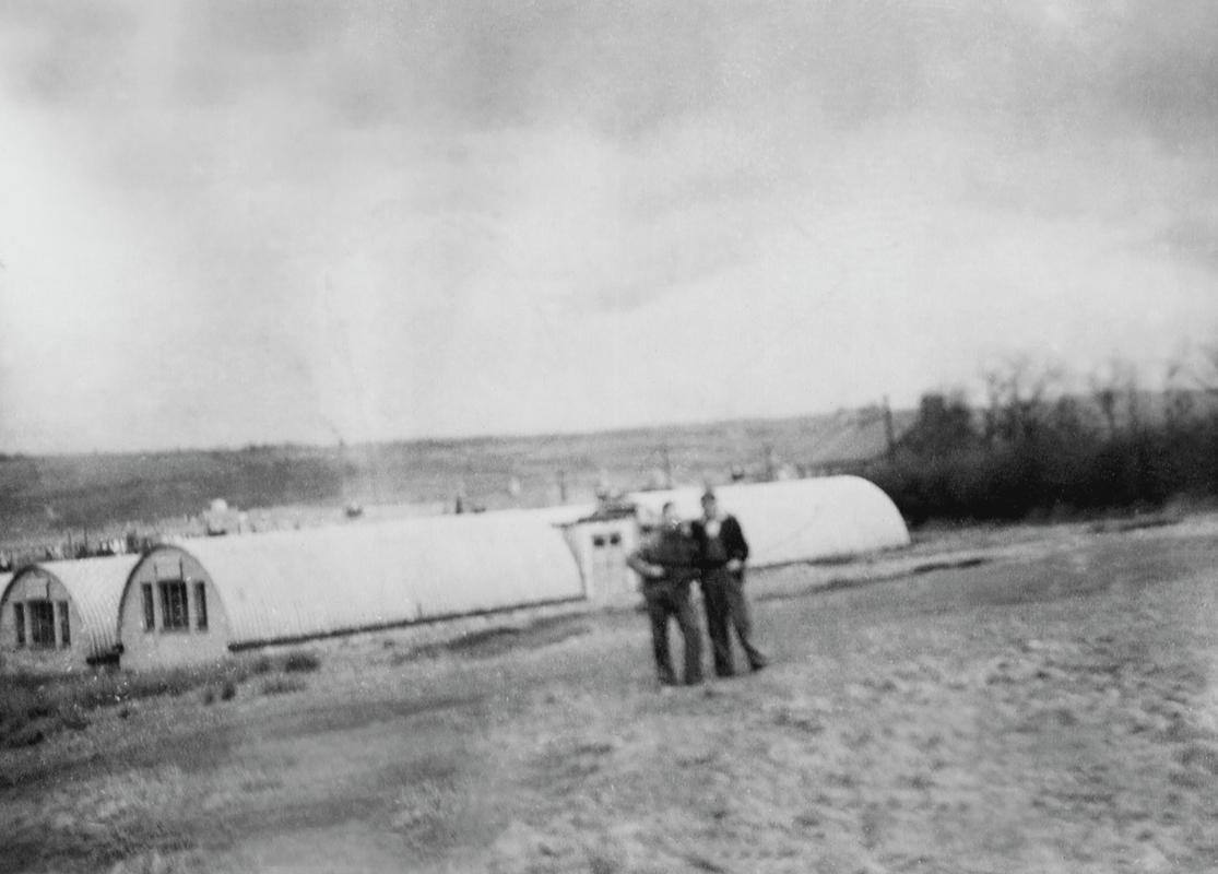 Bevin boys with their Nissen Hut living quarters in the background, Hirwaun.