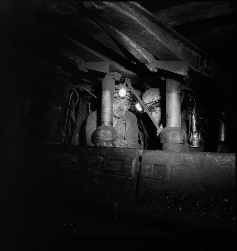 Black and white film negative showing two men underground at Betws Mine.  'Betws' is transcribed from original negative bag.