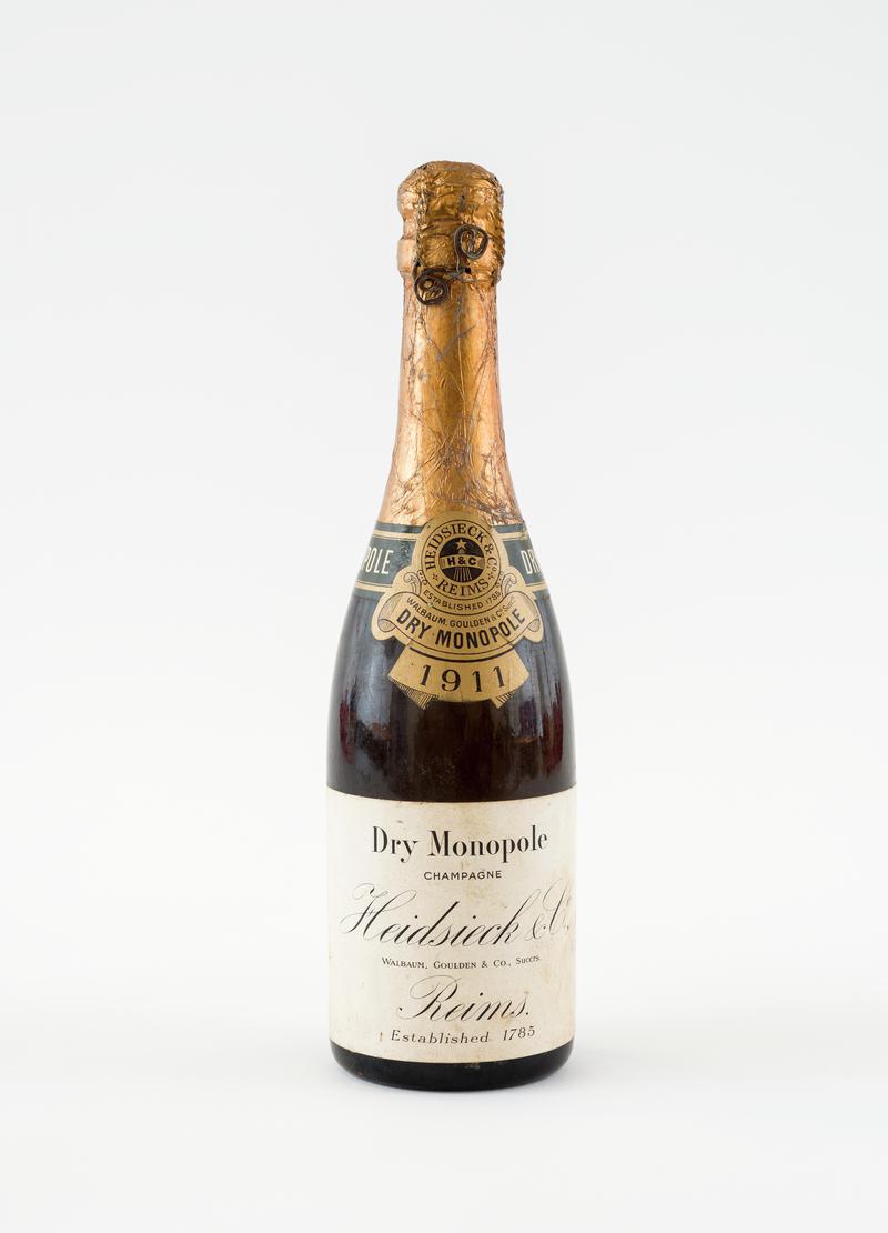 Bottle of champagne. Given to Albert Morgan by Rank Organisation for buying first film for picture house at Oakdale Workmen's Library and Institute.