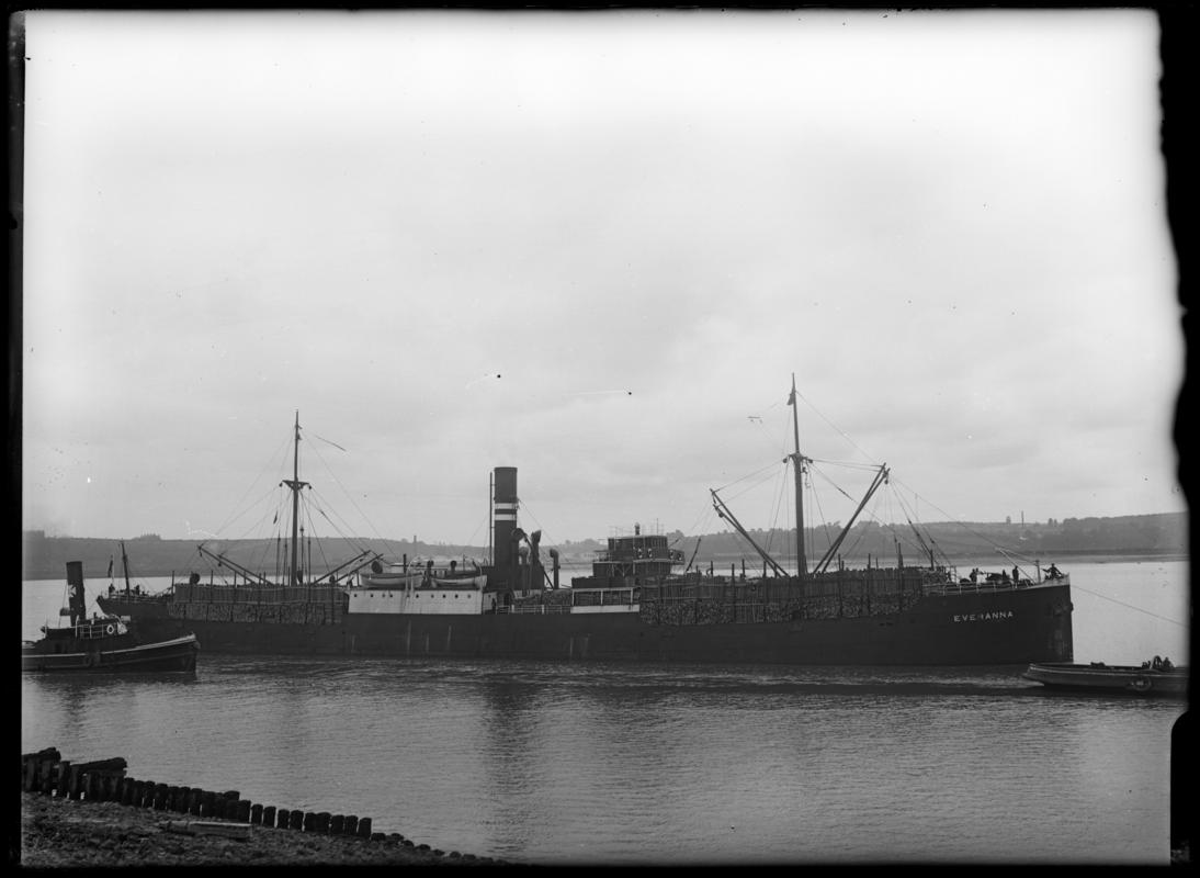 Starboard broadside view of S.S. EVERANNA and tug WARDLEYS, c.1936.