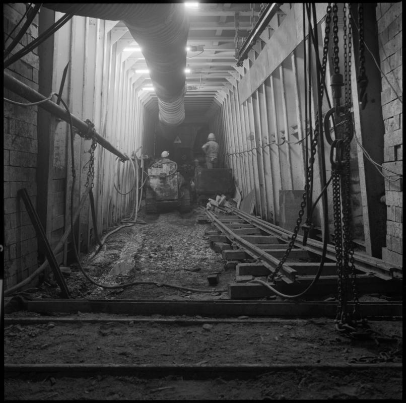 Black and white film negative showing an Eimco machine underground at Lady Windsor Colliery.